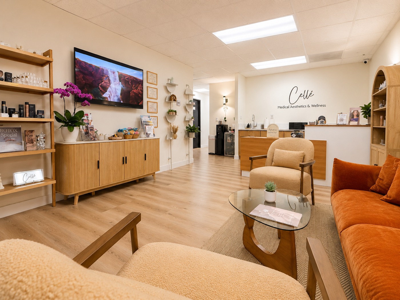 The Cellé Medical Aesthetics lobby in Costa Mesa, warm daylight, cream and wood interior